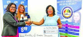 Demerara Bank and GTT reps hand over the monetary support to Human Services and Social Security Minister